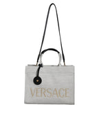 Versace hvit crossbody-veske i kanvasskinn med topphåndtak og logo