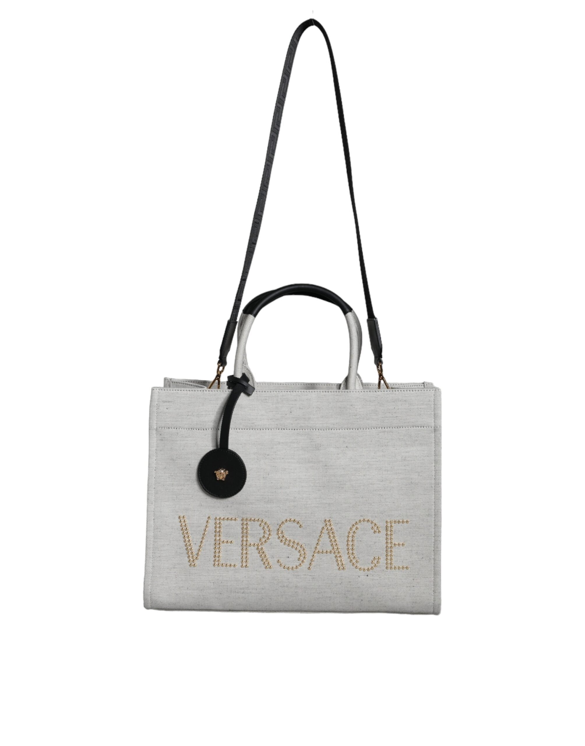 Versace hvit crossbody-veske i kanvasskinn med topphåndtak og logo