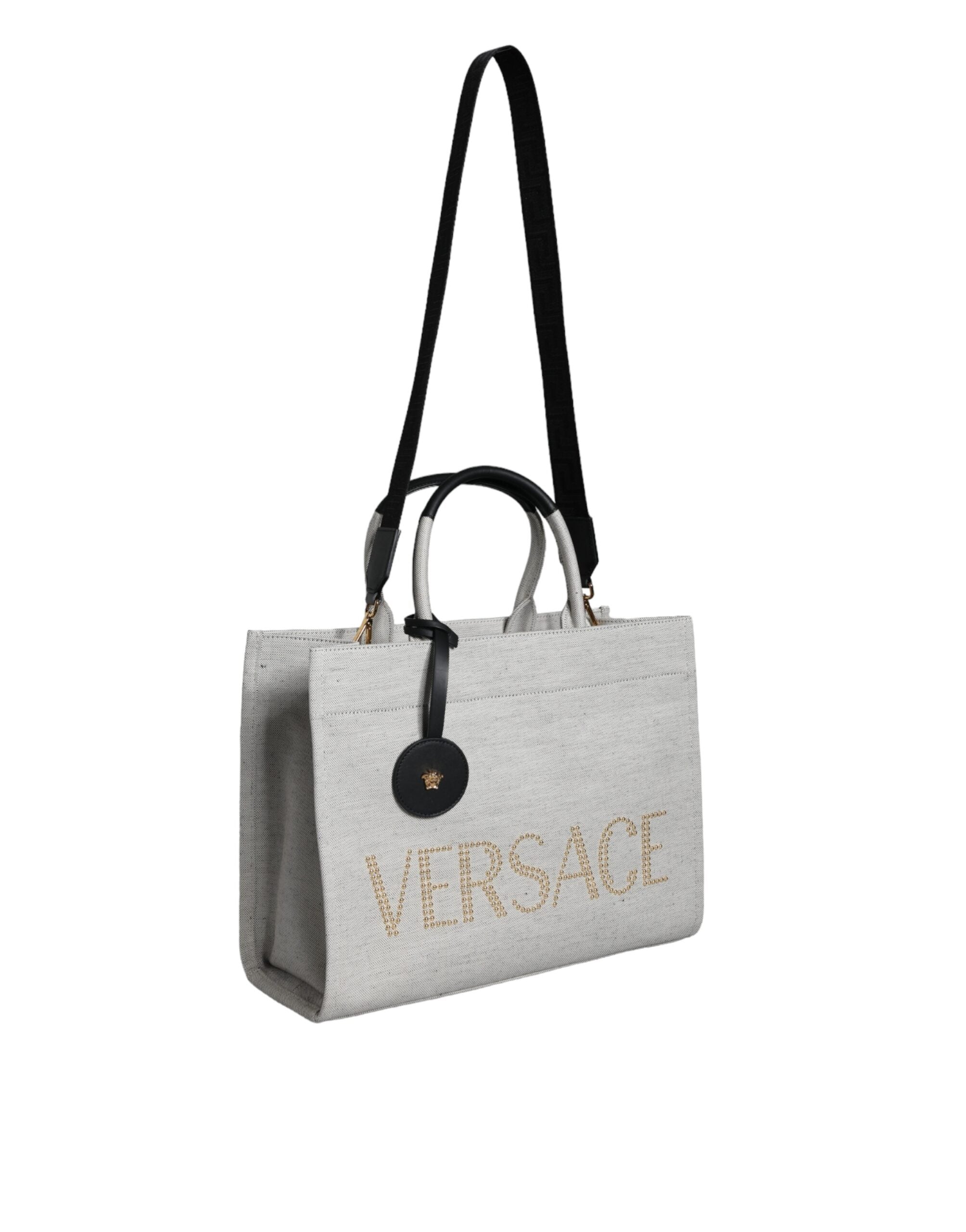 Versace hvit crossbody-veske i kanvasskinn med topphåndtak og logo